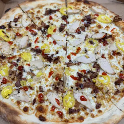 A whole chicken sriracha pizza